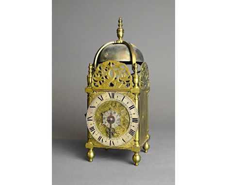 A brass miniature lantern timepiece with alarmIn the Charles II styleThe posted frame surmounted by a turned finial and four 