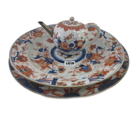 A Chinese Imari dish, circa 1720-50, painted in the centre with circular slightly domed panel enclosing a fan, scroll and flo