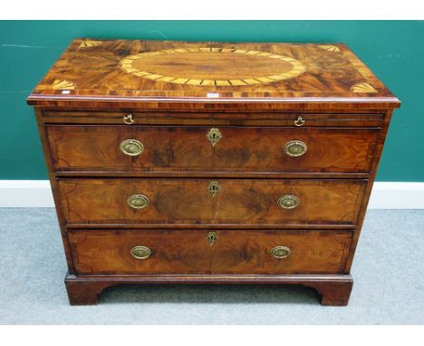 A George III mahogany and later inlaid chest, the brushing slide over three long drawers on bracket feet, 102cm wide x 54cm d
