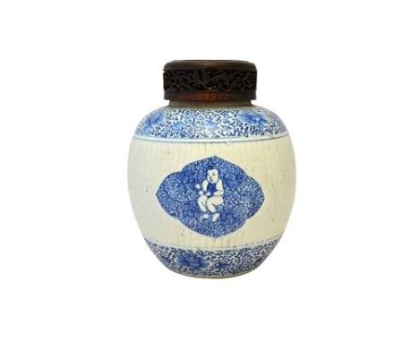 A Chinese blue and white ginger jar, Kangxi, the ribbed sides painted with three barbed panels enclosing a smiling boy, betwe