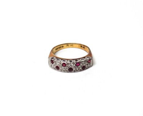 An 18ct gold, ruby and diamond set half hoop ring, mounted with two rows of alternating circular cut rubies and diamonds, rin