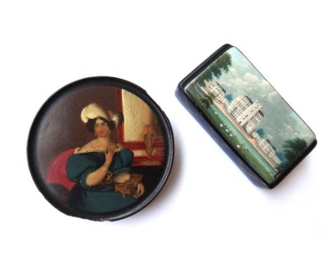 A Stobwasser type circular papier mache snuff box and cover, 19th century, depicting a Georgian lady seated in front of a mir