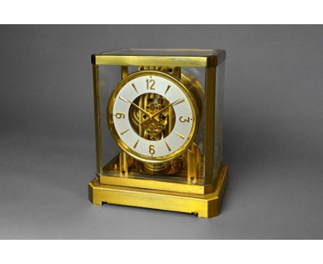 An Atmos clockBy Jaeger-LeCoultre, circa 1980Of typical form, with brass glazed case, the base with a level23.5 cm. high.  Il