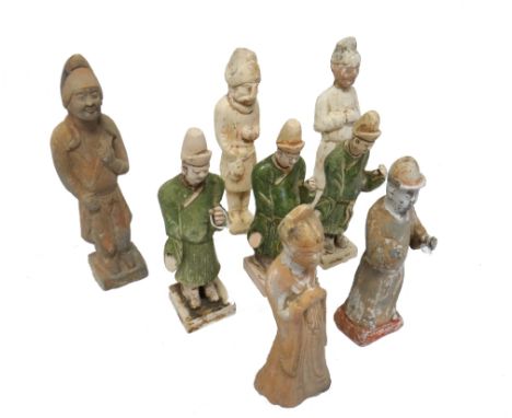 A group of eight various Chinese pottery figures, Tang and Ming dynasty, modelled as ladies, gentlemen, attendants and a fore