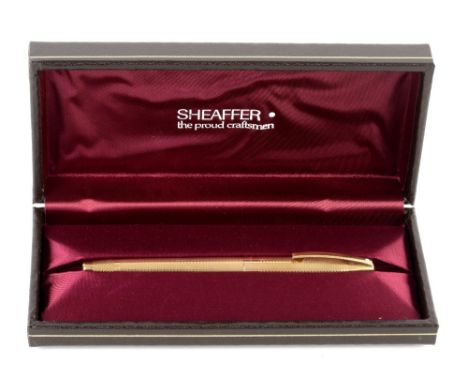 Sheaffer 9 ct yellow gold fountain pen, engine turned detail, 14 ct gold nib, with caseFine scratches to surfaceClip intact, 