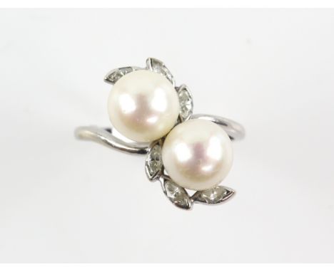 Cultured pearl and diamond twist ring, set with six marquise cut diamonds, estimated total diamond weight 0.24 carats and  tw