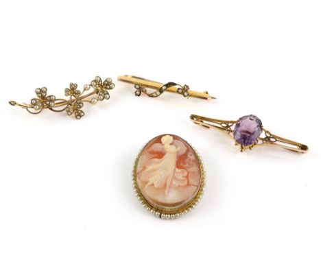 Four brooches, one set with seed pearls in a clover leaf motif, testing as 14 ct, another set with an oval cut amethyst, esti
