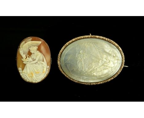 Two brooches, a large carved mother of pearl brooch scene, in ornate engraved frame, testing as 9 ct, pin and catch fitting, 