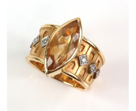 Modern marquise cut yellow topaz ring, estimated topaz weight 3.91 carats, round brilliant cut diamond set shoulders, mounted