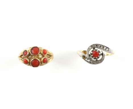 Two coral rings, one twist ring set with round cabochon cut coral and rose cut diamonds, ring size N and six stone coral ring