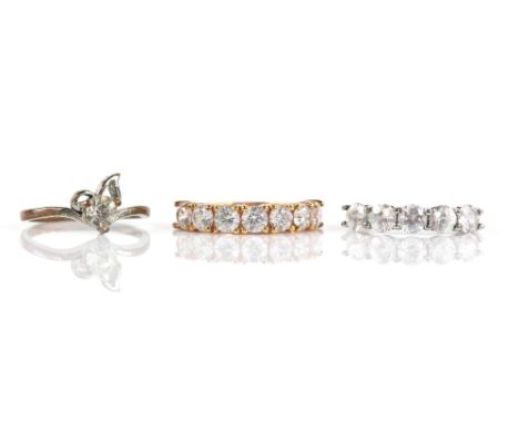 Three rings, a five stone white topaz ring, size N 1/2, in 9 ct white gold, seven stone cubic zirconia ring, and paste single
