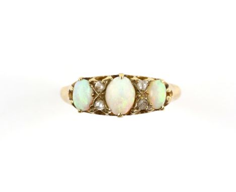 Antique opal ring, set with three oval cabochon cut opals, and four rose cut diamonds, mount stamped 18 ct, ring size M 1/2CO