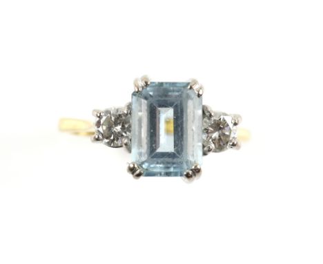 Aquamarine and diamond three stone ring, central aquamarine step cut, estimated weight 2.47 carats, set between two round bri