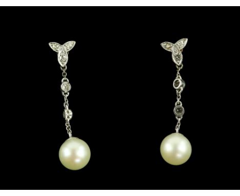 An Edwardian pair of diamond and pearl drop earrings, set with rose and old cut diamonds, estimated total diamond weight 0.20