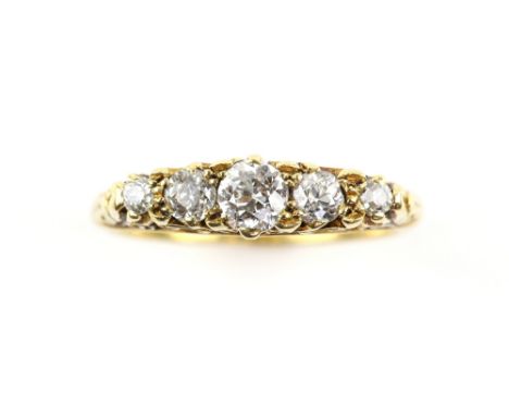 19th C diamond graduated five stone ring, estimated total diamond weight 0.45 carats, scroll mount, shank stamped 18 ct, in M