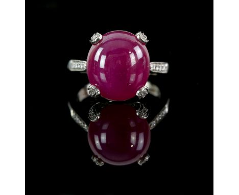 Ruby and diamond ring, with an oval cabochon cut stone, in platinum mount set with diamonds, ruby estimated at 8.60 carat, ri