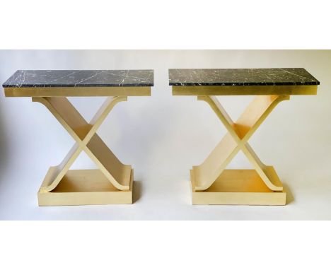 CONSOLE TABLES, a pair, 88cm x 35cm D x 81cm H, bespoke gold leaf decorated X frames with black and gold marble tops. (2) 