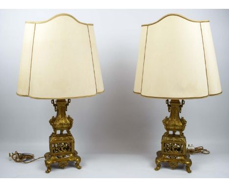 LAMPS, a pair, oriental design, brass, having a masked ringed vase on elephant head adorned and pierced stand, scroll with ha