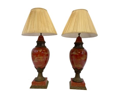 CHINOISERIE TABLE LAMPS, a substantial pair, scarlet and gilt decorated ceramic with gilt metal mounts and shades, 100cm H (2
