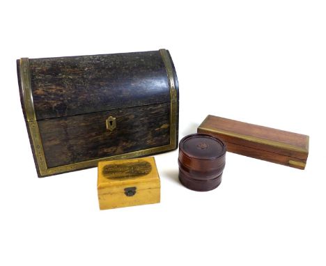A Victorian coromandel veneered box, over pine, the hinged lid with lancet profile, bound with engraved brass edging and escu