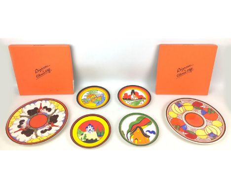A group of four Wedgwood Clarice Cliff Bizarre reproduction plates and two boxed chargers, comprising 'Melon' and 'Summerhous