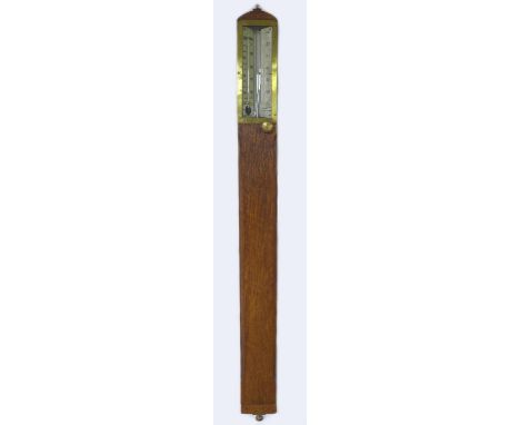 An early 20th century oak wall barometer, marked ?Corrected for Capacity No 849, Annan, London?, 9 by 4 by 96cm high. 