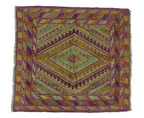 A Gazak rug, with orange, purple and light green diamond shaped decoration, latch hook edges, 125 by 116cm. 