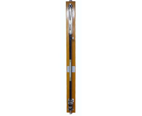 A modern stick barometer, with thermometer, on a mahogany backboard, 8.5 by 8 by 105cm high. 