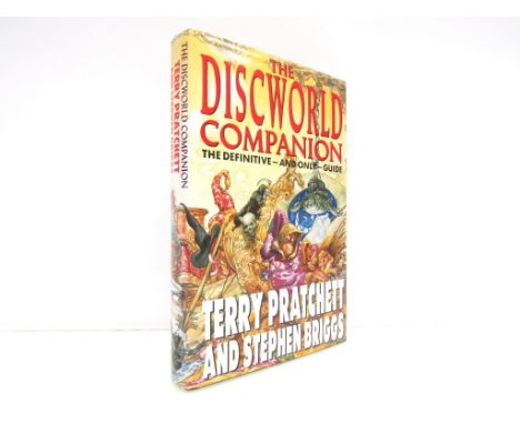 Terry Pratchett &amp; Stephen Briggs: 'The Discworld Companion', London, 1994, first edition, signed and inscribed by Briggs 