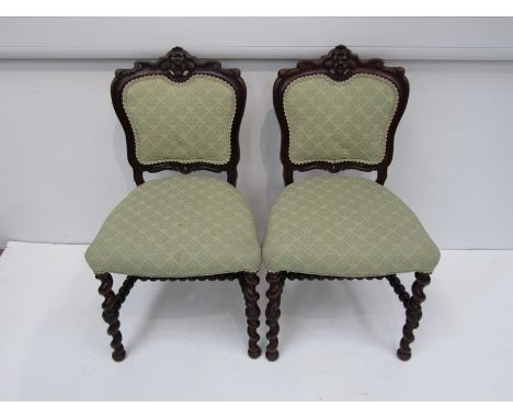 A set of six Victorian rosewood chairs, carved back, green upholstery, raised on sugar twist legs bobbin turned stretchers 
