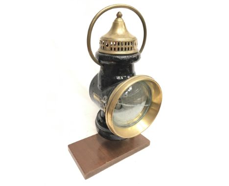 Powell & Hanmer Ltd. (Birmingham) automobile lamp with bronze parts, clear lens, side fitting and handle. Height 34cm, lens d