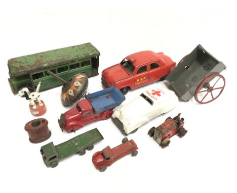 Selection of tinplate toys, includes Lehmann Hop Hop Spinning Top, Minic Fire Chief car l.17cm, Gama Tractor l.6cm and DBW (?