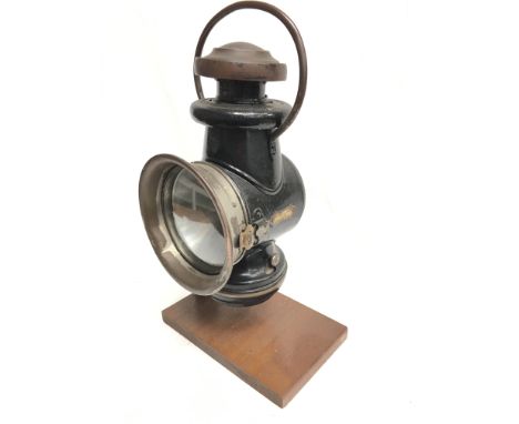 Powell & Hanmer Ltd. (Birmingham) automobile lamp with clear glass lens, side fitting and handle. Height 33cm, lens diameter 