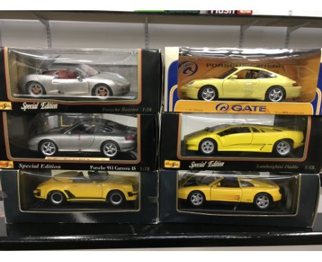 Six 1/18 scale Maisto and Gate diecast models, includes 4 x Porsche. Appear VG+ and boxed. 