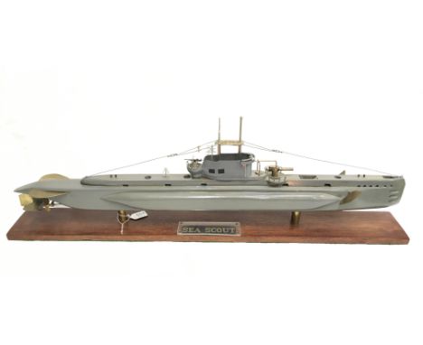 A well-built 'Sea Scout' submarine model, of wooden construction with metal fittings, mounted on display plinth. Length 84cm.