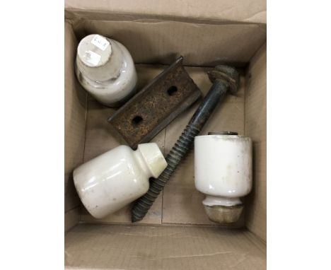 Three GWR ceramic telephone insulators, together with a steel rail locating bolt (18 x 5cm diameter) and a cast iron narrow g