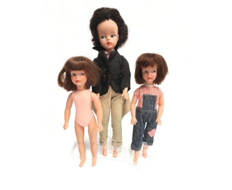 Pedigree Sindy doll, stamped 'Made in England', with brown bubble-cut hair and side glancing eyes, dressed in gingham shirt, 