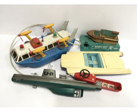 Joustra (France) Hovercraft: tinplate and plastic battery operated model with hand-held control unit (batt. cover missing), l
