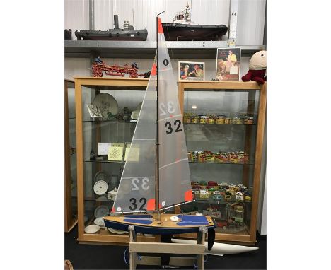 Model Racing Yacht with new sails, includes transmitter and stand. Height 230cm/ 90'' approx. Together with a spare resin hul