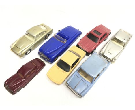 Seven plastic car models, includes Marx (Gt.Britain) clockwork open top car (length 25cm), 2 x Aston Martin (Hong Kong) batte