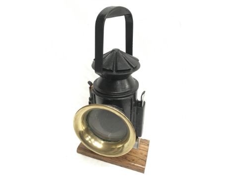 Three aspect hand held signal lamp with clear lens and brass rim, one blue lens to interior. Front lens diameter 9.5cm, heigh