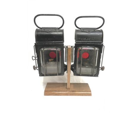 Two Veritas Lamp Works oil-burning lamps, with clear beveled glass lens to front and side, and red rear glass lens. Height 22