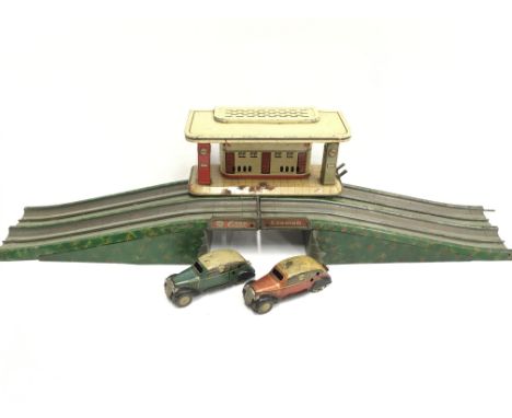 Tinplate electric filling station marked 'Foreign' with Esso and Standard pumps, length 17.5cm, width 7.5cm (G/F with some pa