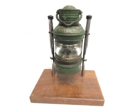 Sea Horse Masthead nautical lamp with curved ribbed glass, painted green, 'Sea Horse GB' trademark to rear door. Height 22cm 