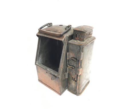 Nautical copper binnacle cover with oil lamp light box to side, handle to top and L-shaped railing hook to rear. Lacks angled