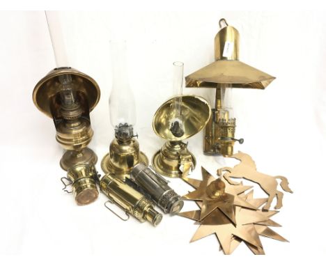 Selection of brass oil lamps: wall mounting lamp with brass shade, height 37cm approx; hand-held example, height 29cm; freest