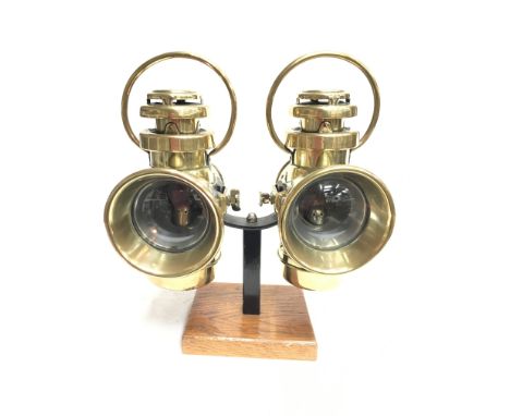 Two Stadium (British-Made) brass automobile lamps, with clear glass lens and small red rear lens. Height 30cm, front lens dia