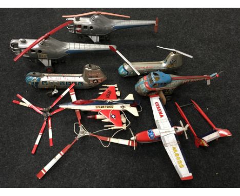 Seven tinplate and plastic aircraft models, includes: 2 x Tudor Rose BEA helicopter, length 37cm; Nomura US Air Force 'US Arm