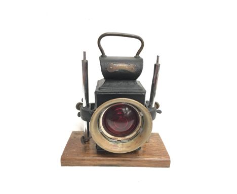 Miller (British-Made) lamp with red front and rear lens. Height 24cm, front lens diameter 7cm. Appears repainted, mounted on 