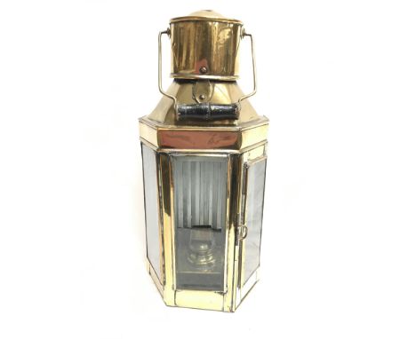 Brass lantern, possibly nautical ship's wardroom lamp, with three beveled glass panels and burner to interior, mounting brack